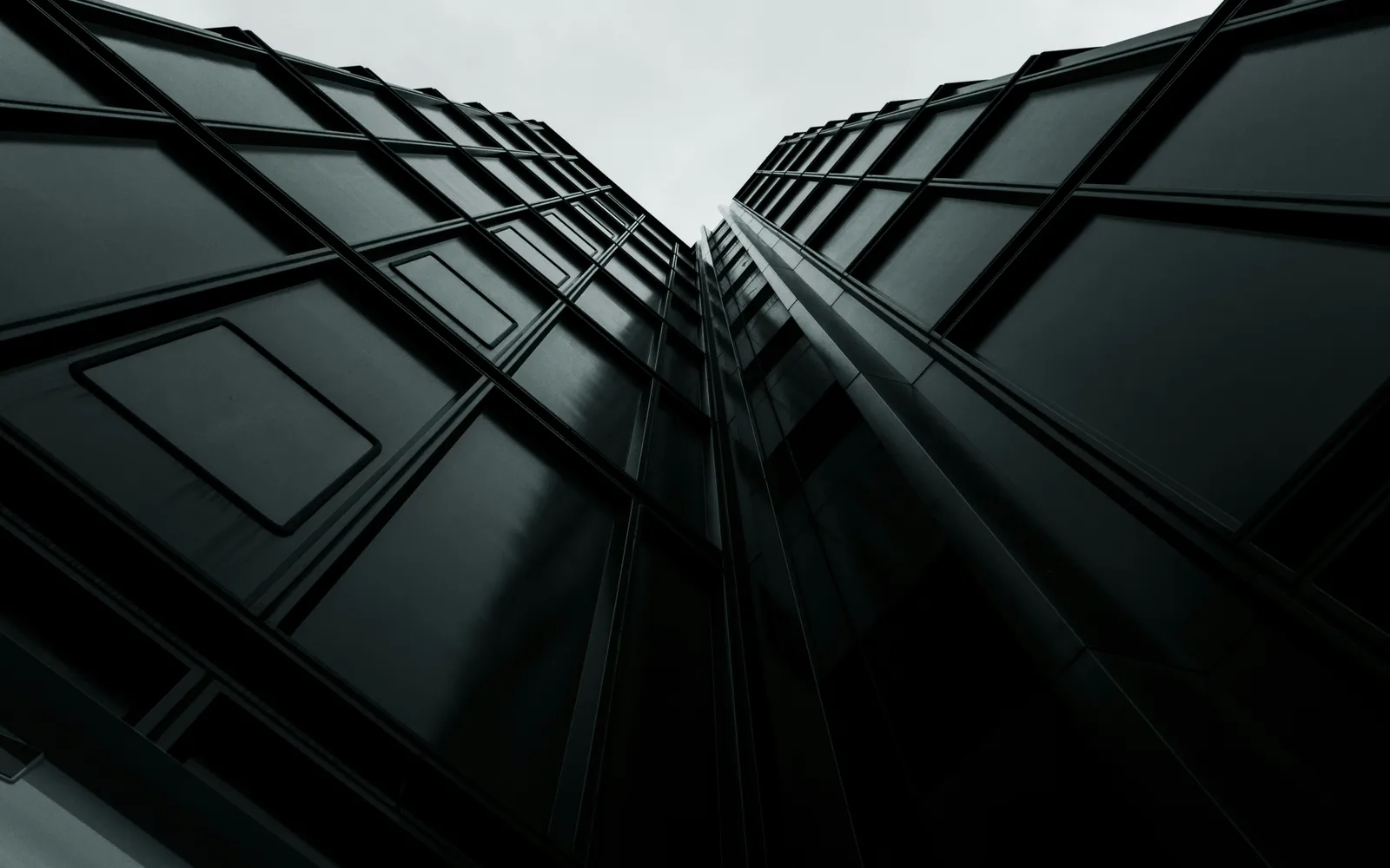 A modern building facade photographed in black and white